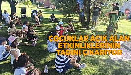 Çocuklar açık alan etkinliklerinin tadını çıkarıyor